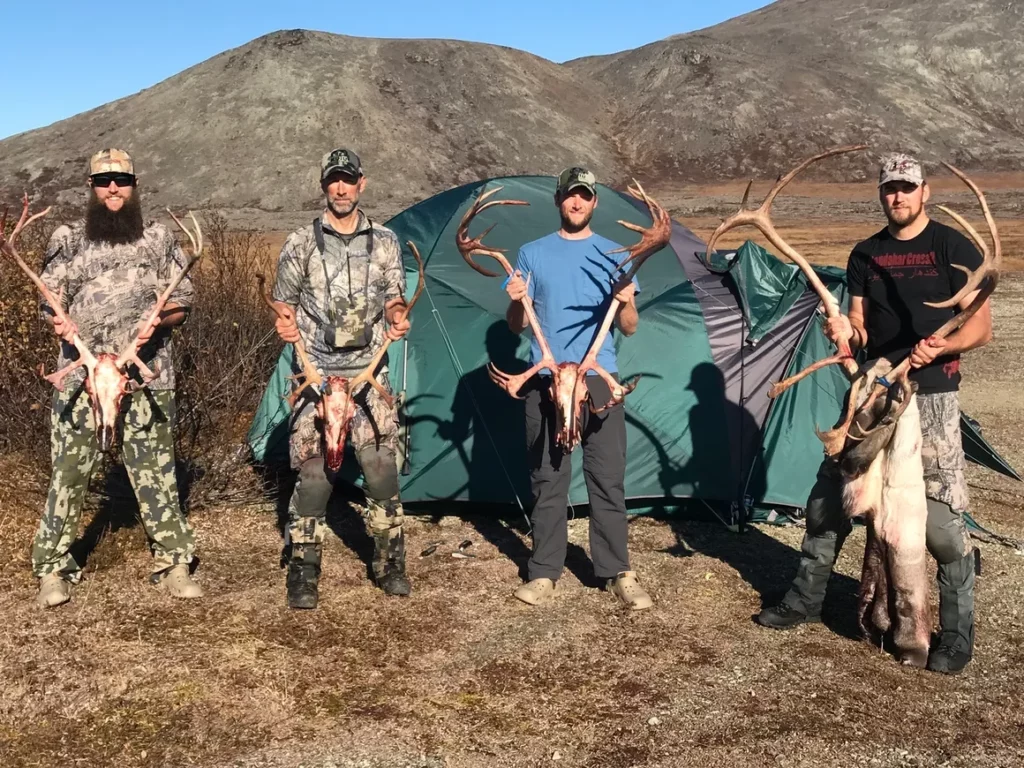 A group of happy diy caribou hunters